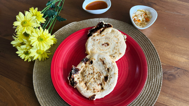 Pupusas on a red plate