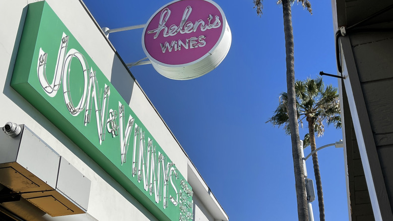 Jon & Vinny's green sign and palm trees
