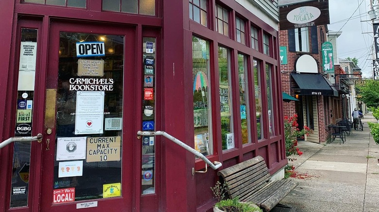 Exterior of Carmichael's Bookstore and nearby storefronts.