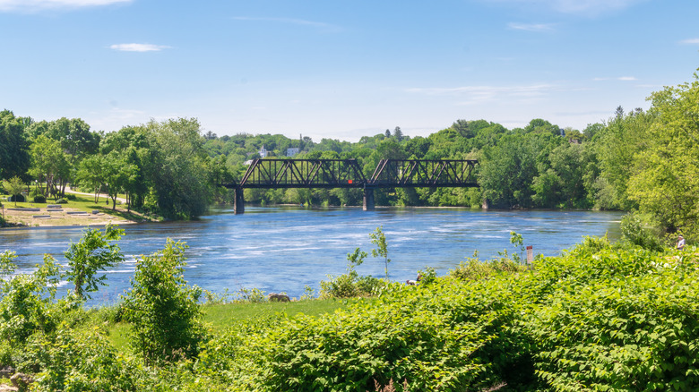 A pedestrian bridge spanning the Androscoggin River connects Lewiston and Auburn