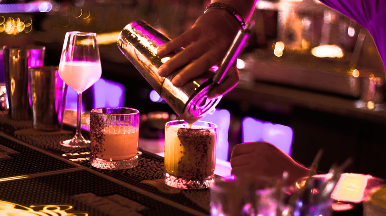 Bartender making craft cocktails