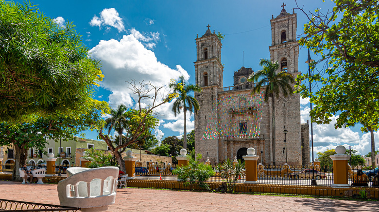 Central park and a cathedral in Valladolid, Mexico on a sunny day