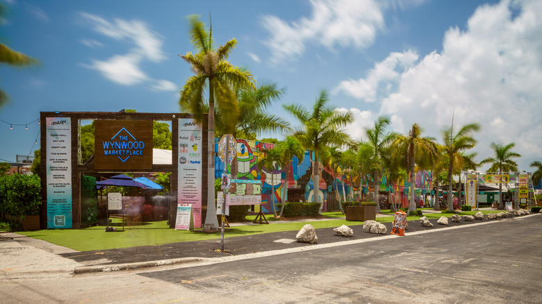 Exterior of Wynwood Marketplace with palm trees