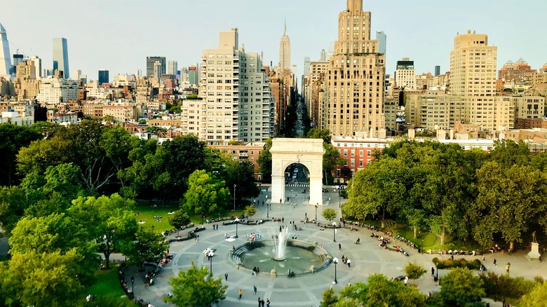 Washington Square Park is a Greenwich Village hub with a fountain, playgrounds, and shaded benches.