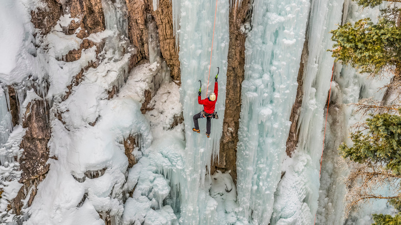 Ice climber ascending ice column in Ouray, Colorado