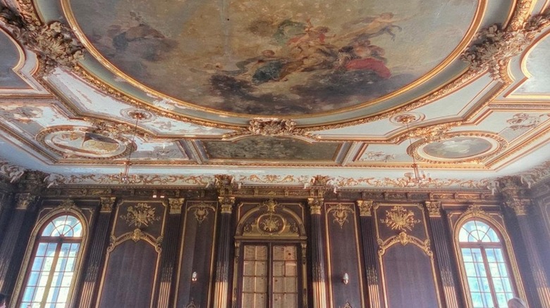 The ballroom in Lynnewood Hall, with painted ceiling and gold accents