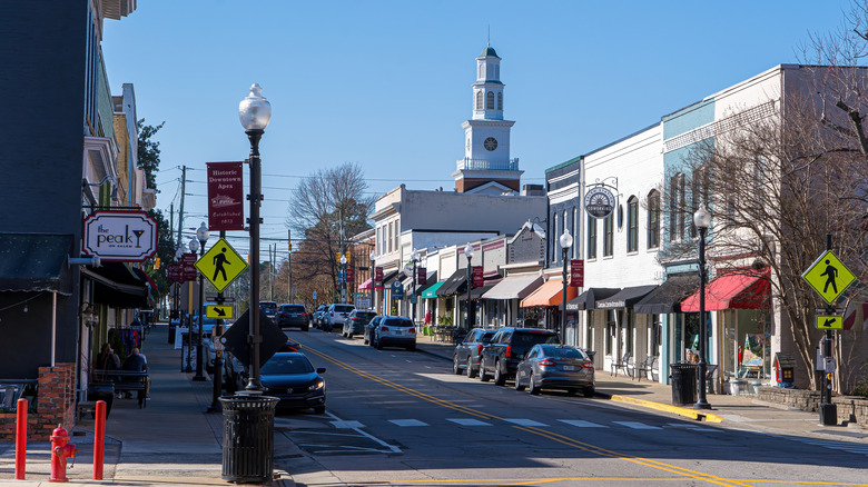 A view of downtown Apex with a church spire in the background