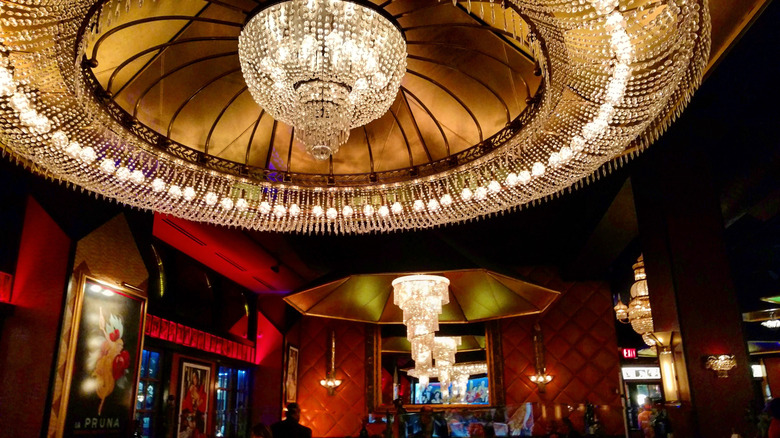 Opulent ceiling at Jeff Ruby's Cincinnati showing chandeliers and red decor