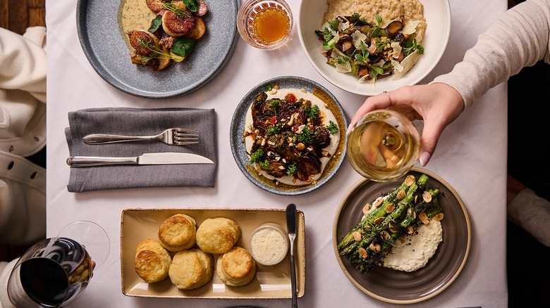 aerial shot of food and wine on a table in a restaurant
