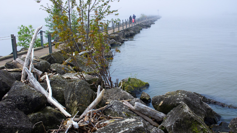 A family walking on a long pier at Lorain in Ohio