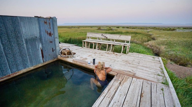 A woman in a hot spring bath at the Alvord Desert in Oregon