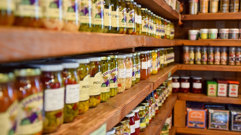 Shelves stocked with Amish goods like jarred vegetables and spices