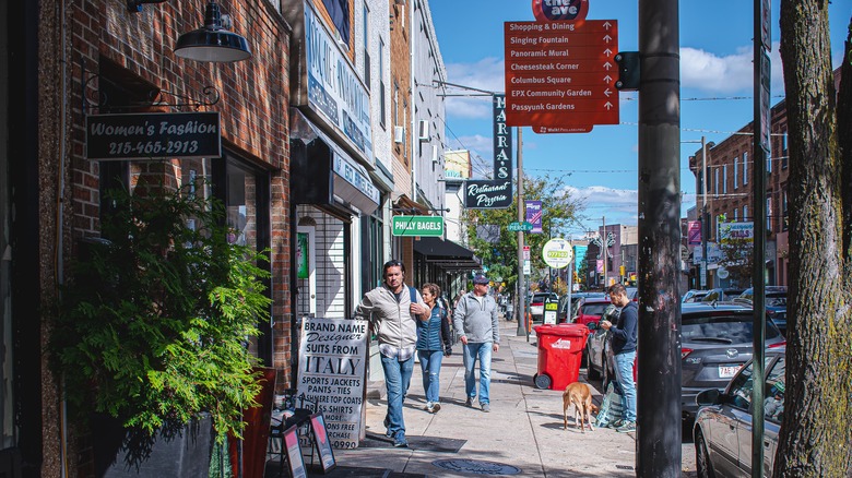 People strolling past shops in Passyunk Square