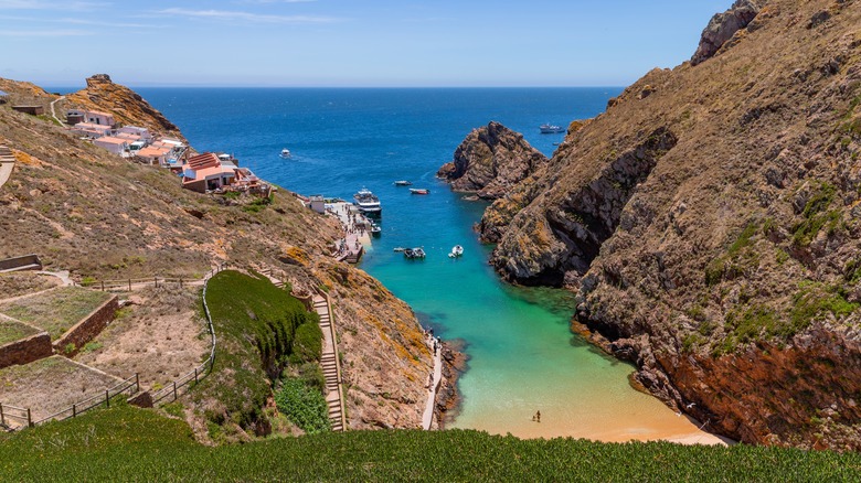 Ocean view with rugged cliffs and a small fishing village