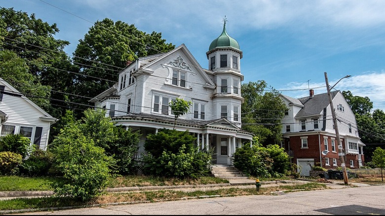 A historic house with a three-story tower on Higgins Avenue in Providence's Elmhurst section.