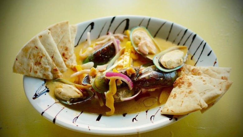 A bowl of coconut curry mussels