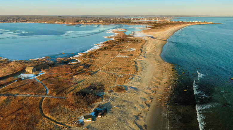 Water on both sides of South Shore Beach approach leading up to Goosewing Beach Preserve in Rhode Island during winter.