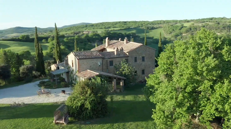 Aerial view of the Cretaiole farm stay surrounded by lush hillsides