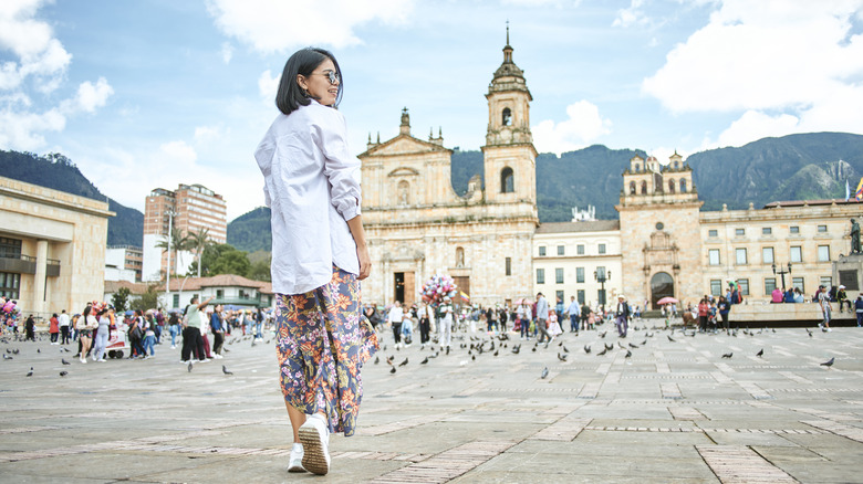 A woman walking in Bolivar Square in Bogota, Colombia
