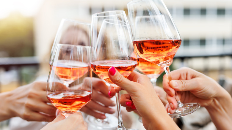 People cheers-ing with wine