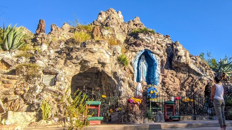 Rocky grotto with Madonna statue in nook