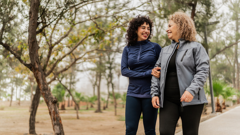 Mother and daughter in a wooded park