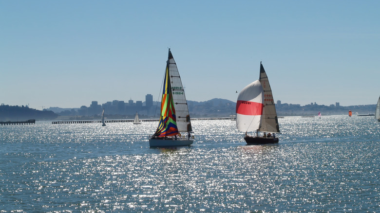 Two sailboats making their way into the Berkeley Marina