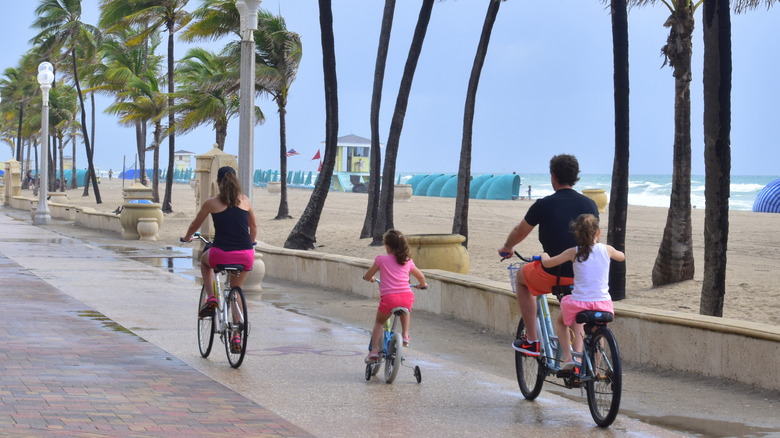 Family biking on the boardwalk