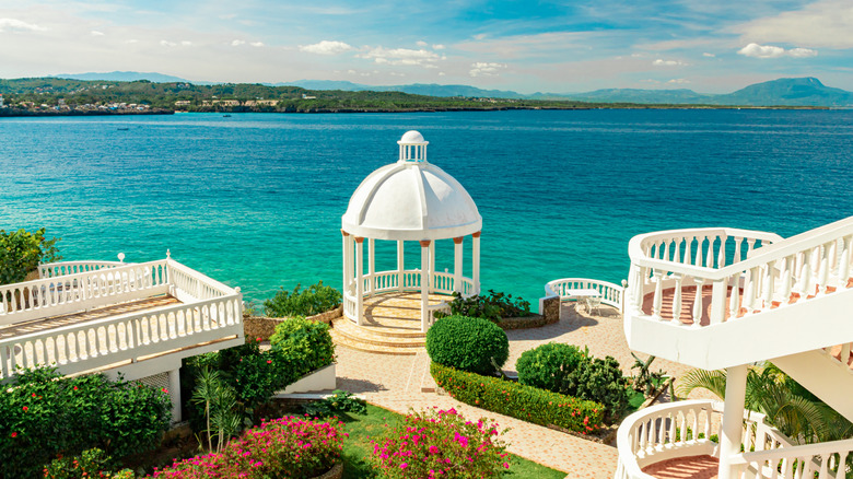 White gondala and staircase overlooking turquoise waters in Puerto Plata, Dominican Republic