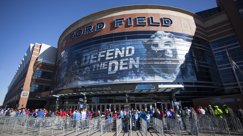 Detroit Lions fans queuing outside Ford Field on an NFL game day.