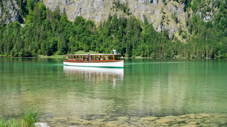 A boat sails across the waters of the Königssee