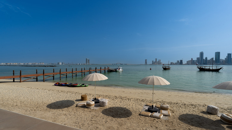 Beach and city skyline in Bahrain