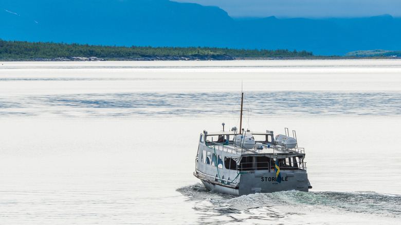 A boat crosses the surface of Lake Akkajaure in northern Sweden