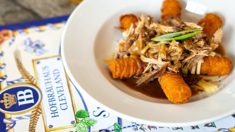 Plate of food atop a menu