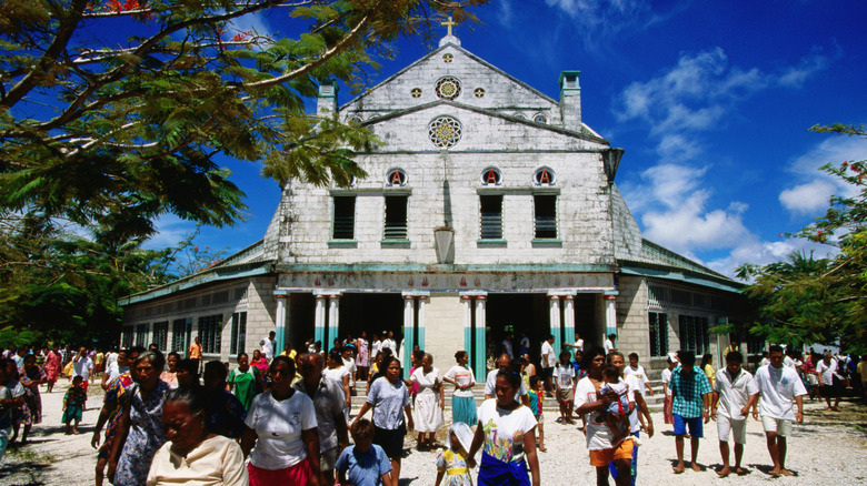 People gathered outside of a church in Tawara, Kiribati
