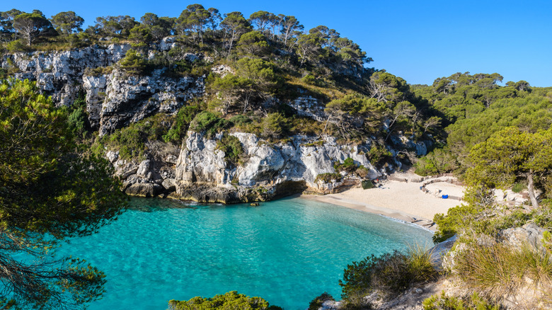 White sand beach in the cove of Cala Macarelleta, Portugal