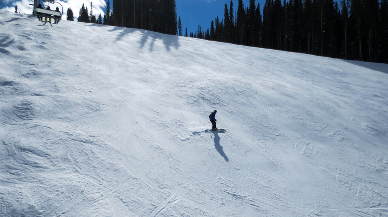Silhouette of a snowboarder on a ski hill at Purgatory Ski Resort