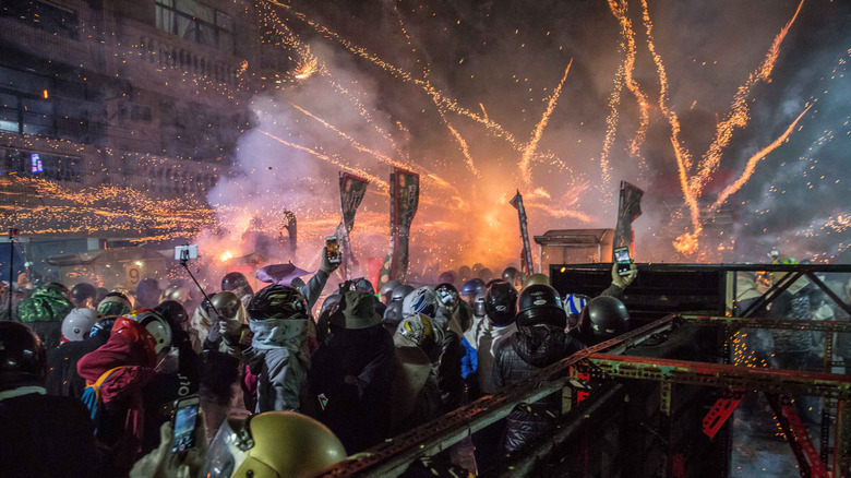 Dense crowd watches firecrackers
