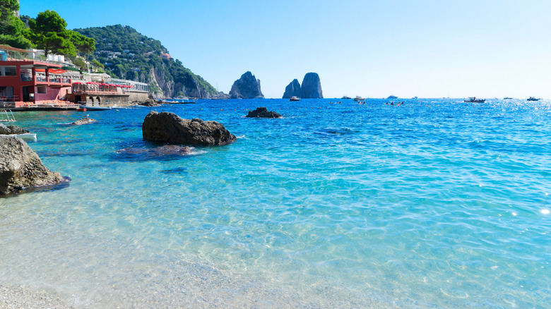 striking blue water with view of rock formations at Marina Piccoli