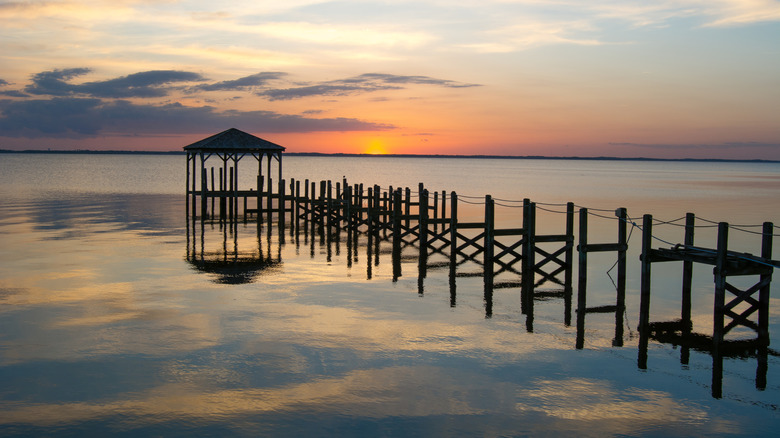 silhouette of abandoned pier and gazebo at sunset, Albemarle Sound, North Carolina
