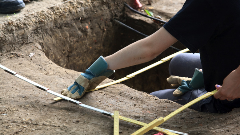 an archeologist working in the sand