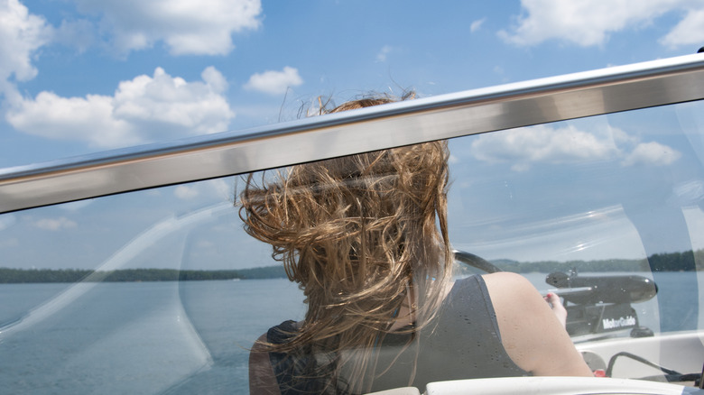 person boating on lake martin