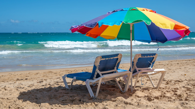 Rainbow beach umbrella on Condado Beach in San Juan