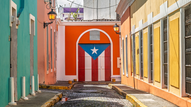 Colorful streets leading to a Puerto Rican flag painted door