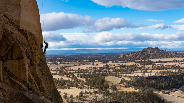Climber dangles off Monkey Face at Smith Rock State Park