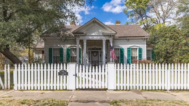 small house with white picket fence in small Texas town