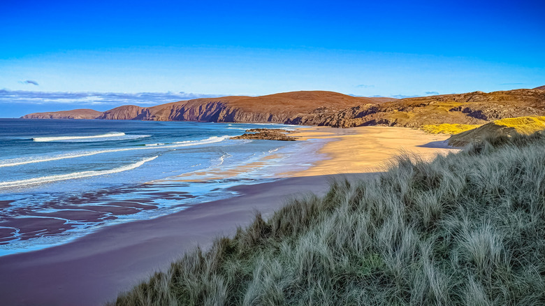 The quiet, remote Sandwood Bay Beach lies close to the end of the Cape Wrath Trail