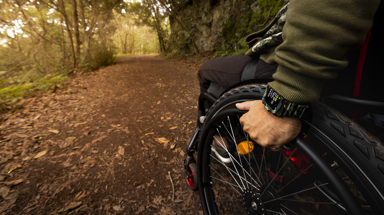 Man in wheelchair on trail
