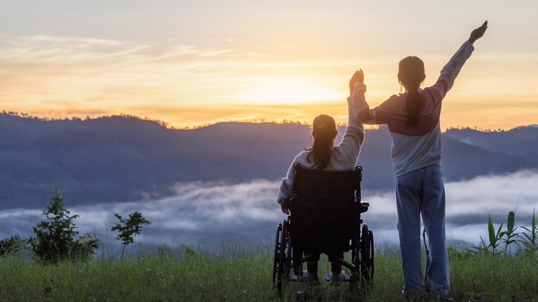 Two woman looking at mountains