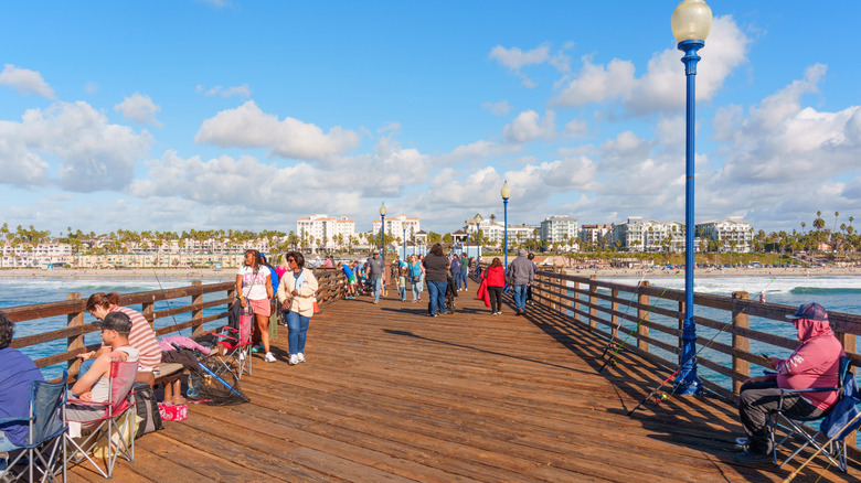 people fishing and walking on the Oceanside Pier